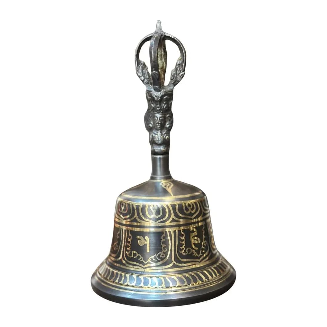 A bronze meditation bell with its ornate cast bajra handle