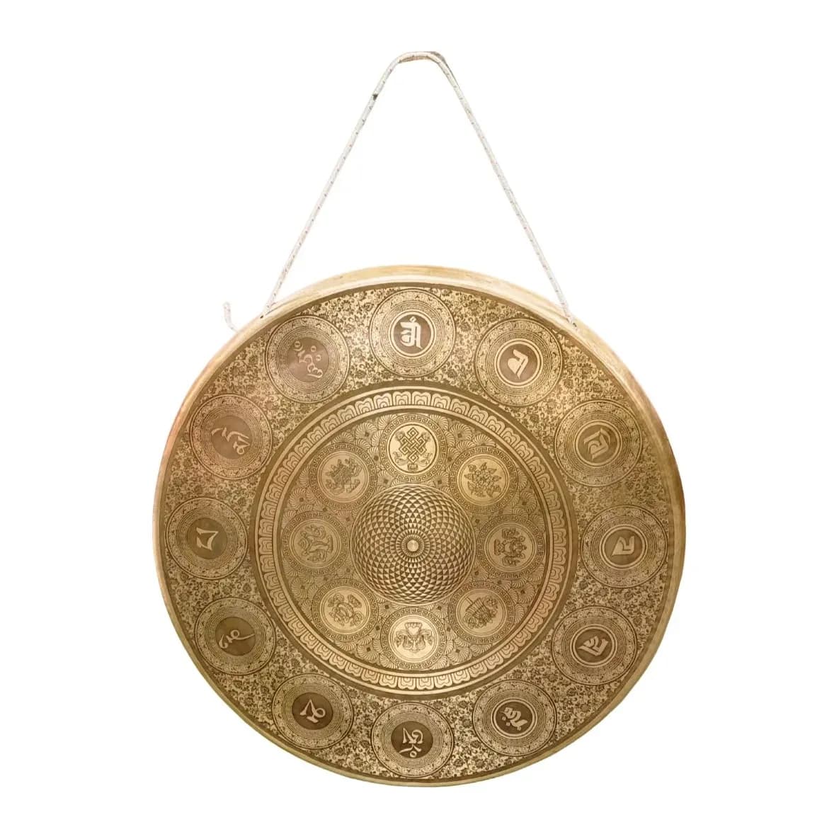 A large bronze gong intricately etched with a detailed mandala, hanging by its cord
