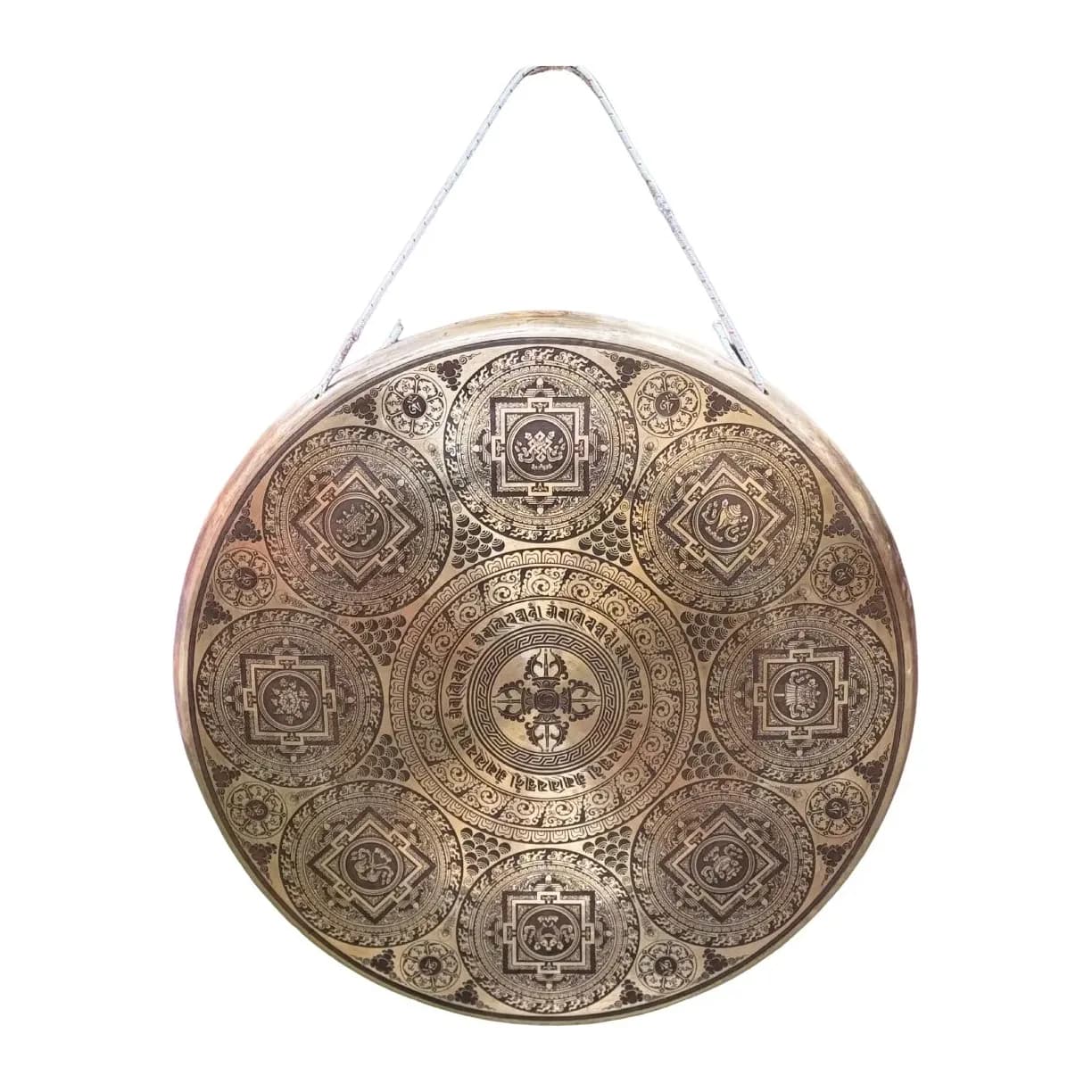 A large bronze gong intricately etched with a detailed mandala, hanging by its cord
